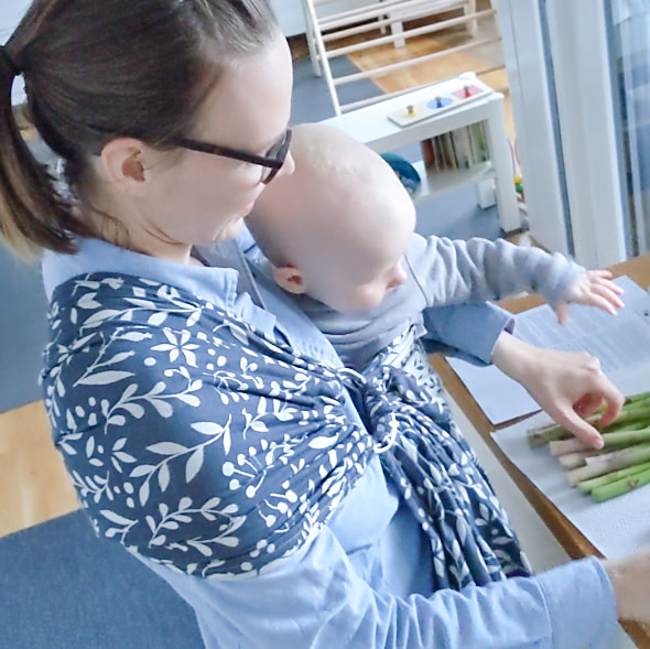 Babywearing mom cooking Babywearing mom cooking