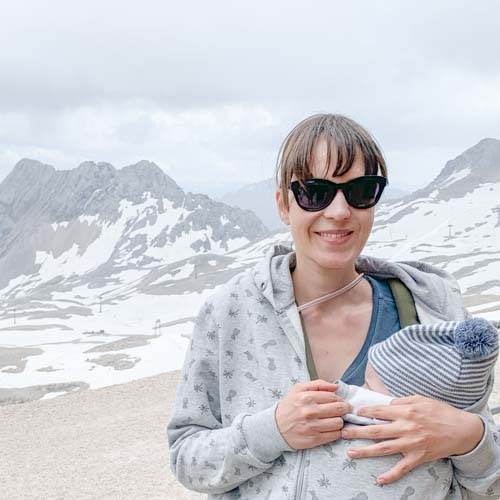 Babywearing mama carrying her baby in the mountains Babywearing mama carrying her baby in the mountains